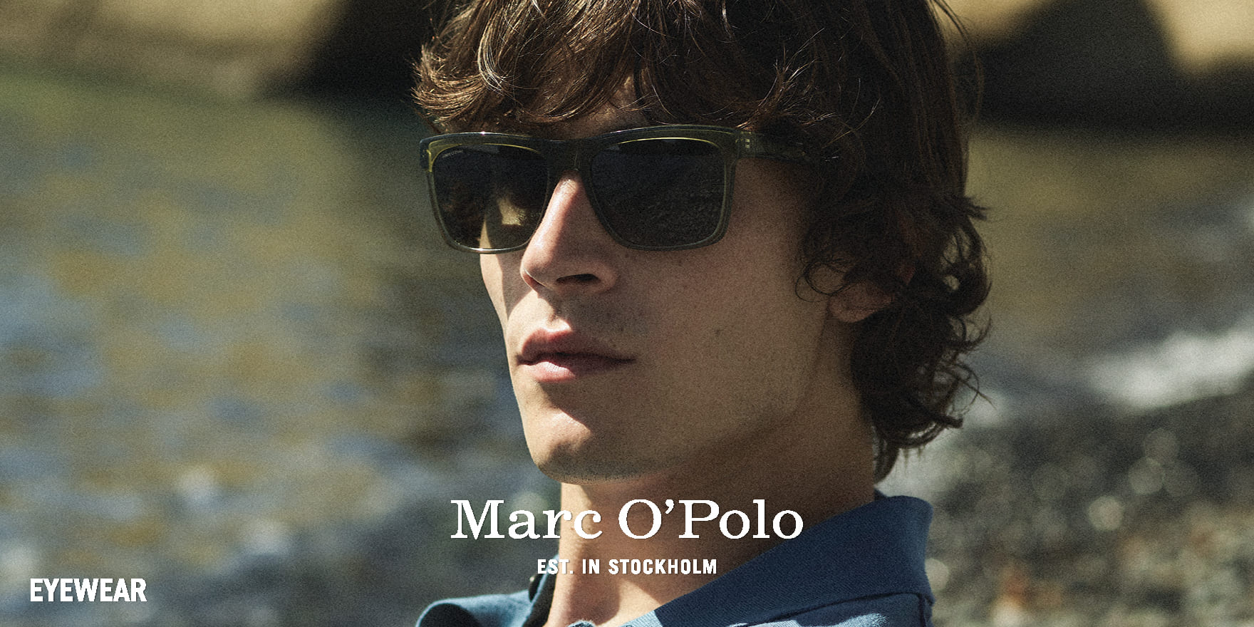 Junger Mann mit lässiger dunkelgrüner Marc o Polo Sonnenbrille von Optik Gronde, Augsburg